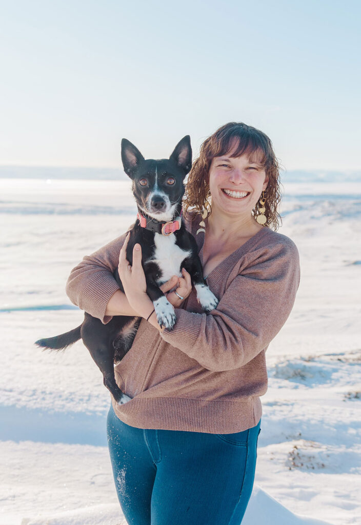 Jasmine, founder of Oldham Administrative Solutions, outdoors with her dog.